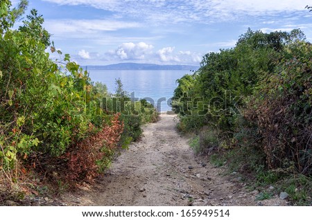 Gravel path to a secluded beach in Sithonia, Chalkidiki, Greece