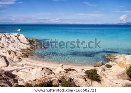 Little sandy beach between the rocks, in Sithonia, Chalkidiki, Greece