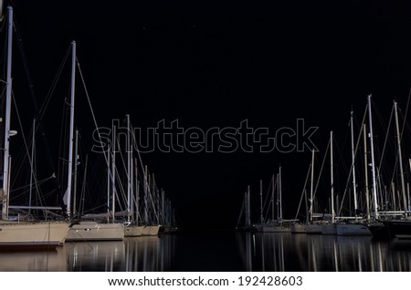 Night scene in a marina with moored yachts, in Lefkada island, Greece