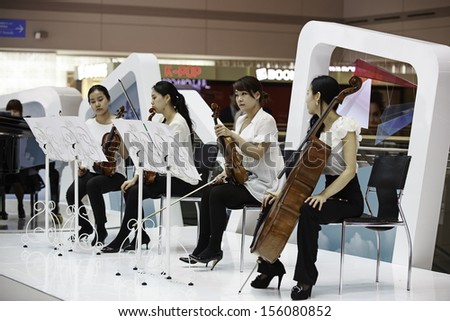 INCHEON, SOUTH KOREA - JULY, 01: Group of musicians performing at Incheon International Airport on July 01, 2013 in South Korea. Incheon International Airport is the largest airport in South Korea.