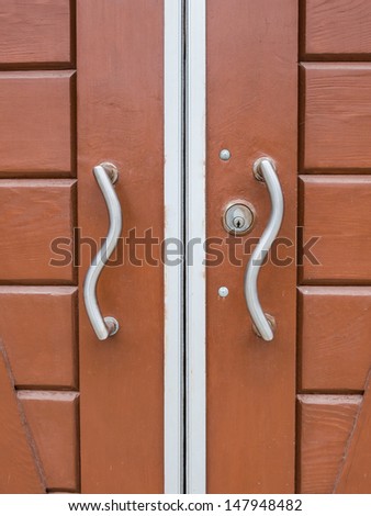 Wood Door with Wavy Silver Handles