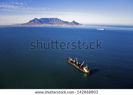 Aerial view of ship in Table Bay with Table Mountain, Cape Town, South Africa
