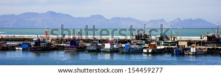 Old wooden fishing boats in Kalk Bay Harbour, Cape Town, South Africa