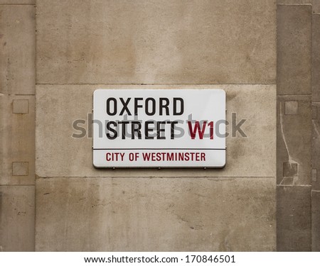 LONDON, UK - AUGUST 6, 2013: A sign on a street wall for Oxford Street in Central London