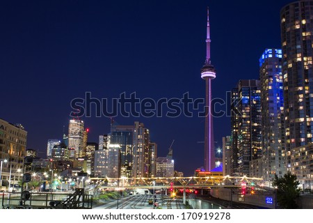 TORONTO, CANADA - OCTOBER 8, 2013: An urban scene from Toronto showing the CN Tower, Skyscrapers and Condos at night