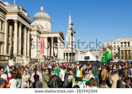 LONDON, UK - 16TH MARCH 2014: St Patrick\'s day celebrations at Trafalgar Square in central London showing large crowds of people