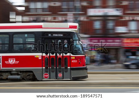 TORONTO, CANADA - 26TH APRIL 2014: The front of a moving Street Car in Toronto along a road