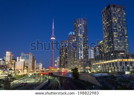 TORONTO, CANADA - OCTOBER 8, 2013: An urban scene from Toronto showing the CN Tower, Skyscrapers and Condos at night