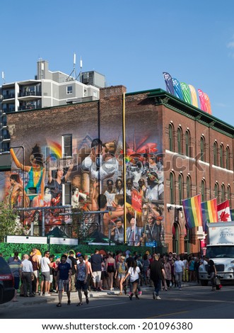 TORONTO, CANADA - 26TH JUNE 2014: Large amounts of people queuing to get in to an event down Church for World Pride