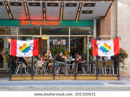 TORONTO, CANADA - 26 JUNE 2014: Signs outside Restaurants to show support for World Pride in Toronto
