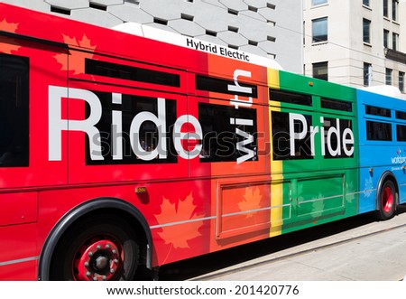 TORONTO, CANADA - 28TH JUNE 2014: A TTC bus in central Toronto painted as part of the World Pride Celebrations