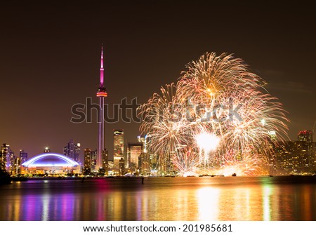 TORONTO, CANADA - 30TH JUNE 2014: Fireworks in Toronto for Canada Day showing the City and local landmarks