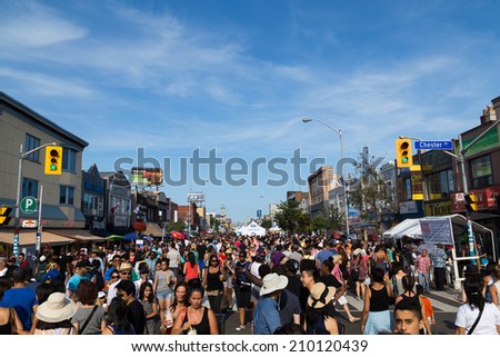 TORONTO, CANADA - 10 AUGUST 2014: Large crowds along Danforth Street for the Taste of Danforth Festival in Toronto