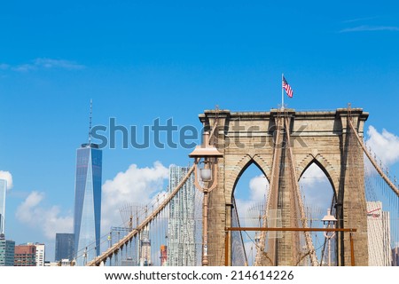 NEW YORK CITY, USA - 1ST SEPTEMBER 2014: A view of the arches of Brooklyn Bridge in NYC with One World Trade Center in the background