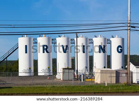 CAPE BRETON, CANADA - 25TH AUGUST 2014: Large white diesel containers with the words Irving on them.