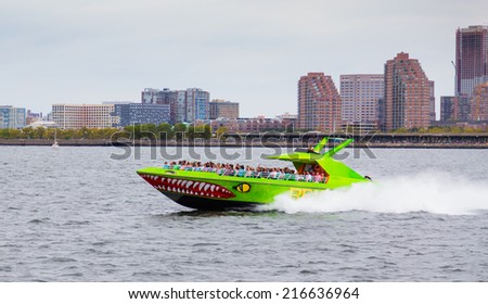 NEW YORK CITY, USA - 30TH AUGUST 2014: A boat on the Hudson River during the day. Large amounts of people can be seen on the boat