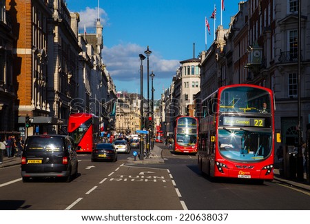 LONDON, UK - 26TH SEPTEMBER 2014: A view down Piccadilly in central London. Buses can people can be seen along the street.