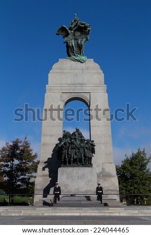 OTTAWA, CANADA -  12TH OCTOBER 2014: The National War Memorial of Canada during the day showing two guards at the base of the structure