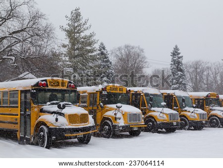 TORONTO, CANADA - 11TH DECEMBER 2014: Toronto School Bus\'s parked up during the snow
