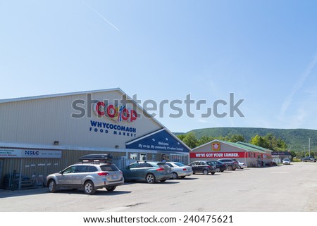 CAPE BRETON, CANADA - 25TH AUGUST 2014: The outside of a CO-OP and Home Hardware store in Cape Breton. Hills can be seen in the distant