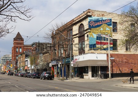 TORONTO, CANADA - 18TH MAY 2014: A view of part of Riverside in East Toronto during the day. People can be seen on the street