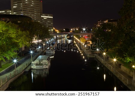 OTTAWA, CANADA - 12TH OCTOBER 2014: The Rideau Canal in Ottawa at night. Boats can be seen