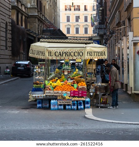 ROME - ITALY, 11TH MARCH 2015: A fruit stand in rome during the day. People can be seen near the stand