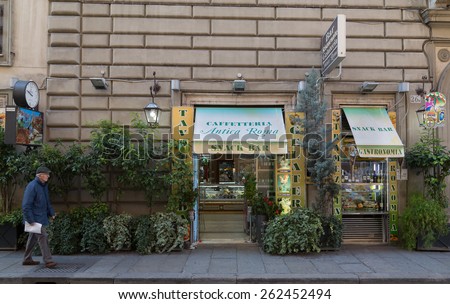 ROME, ITALY - 12TH MARCH 2015: The outside of a Snack Bar in Rome during the day. A man can be seen walking past