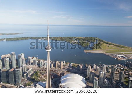 TORONTO, CANADA - 6TH JUNE 2015: A view towards Lake Ontario from the Air showing some buildings in downtown Toronto, The CN Tower and the Island Park.