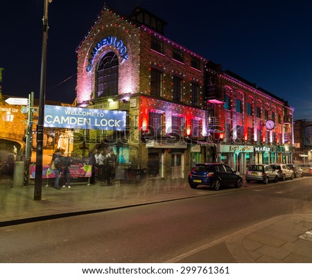 LONDON, UK - 17TH JULY 2015: The outside of buildings and a bridge in Camden Lock at night.