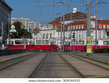 VIENNA, AUSTRIA - 4TH AUGUST 2015: An old Tram in Vienna during the day. Buildings can be seen behind it and people can be seen.