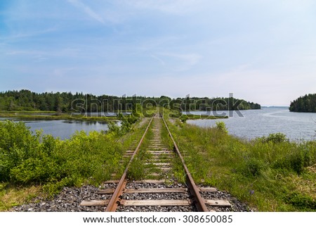 Old Railyway Tracks in Cape Breton Island. Lakes and Trees can be seen.