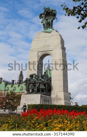 OTTAWA, CANADA -  11TH OCTOBER 2014: The National War Memorial of Canada during the day showing two guards at the base of the structure