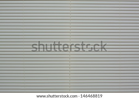 light color plastic blinds on the window