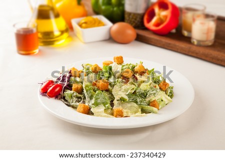 Caesar salad ingredients in a dish on the table