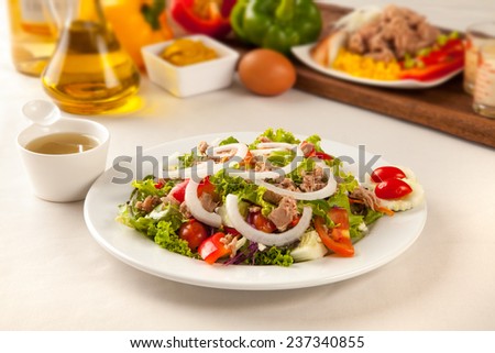 Tuna salad ingredients in a dish on the table