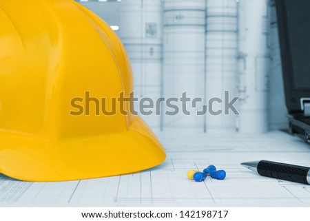 Construction project management tools - helmet, drawings and planning