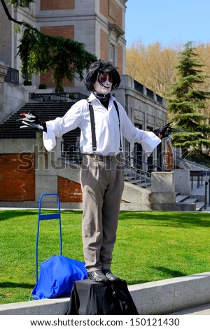 MADRID, SPAIN - JULY 5: Street performer doing his Edward scissorhand piece in the center of Madrid in front of the Prado museum on July 5, 2012 in Madrid, Spain.
