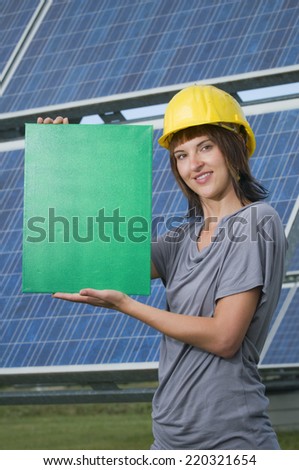 girl with helmet and green card