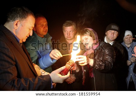 ODESSA - APRIL 14: Pilgrims brought the Holy Fire ritual of the Holy Sepulchre (Holy Light) Holy Saturday Easter in Odessa, Ukraine, April 14, 2012.