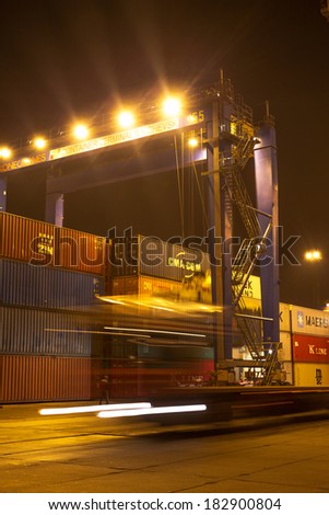 ODESSA NOVEMBER 27: Unloading loading containers on maritime vessels in Iyichevck seaport at night , around the clock, November 27, 2012 Odessa, Ukraine