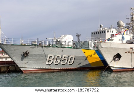 ODESSA, UKRAINE - APRIL 6: Maritime Boundary  Navy, naval ships and sailors in the harbor  Odessa. Military equipment of ships , guns and torpedo installation , marine flags , Ukraine, April 6, 2014 .