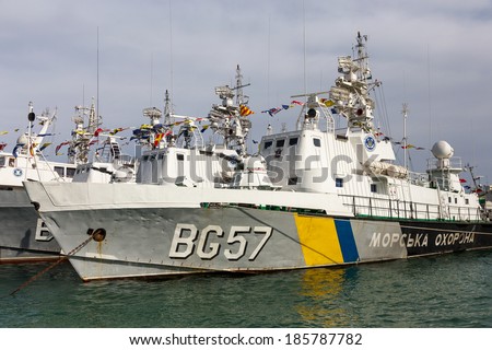 ODESSA, UKRAINE - APRIL 6: Maritime Boundary  Navy, naval ships and sailors in the harbor  Odessa. Military equipment of ships , guns and torpedo installation , marine flags , Ukraine, April 6, 2014 .