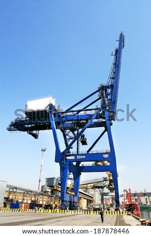 ODESSA, UKRAINE - APRIL 15: industrial sea cargo cranes on the dock harbor of Odessa Sea Commercial Port of loading in Odessa marine vessel cargo container terminal , April 15, 2014 Odessa, Ukraine