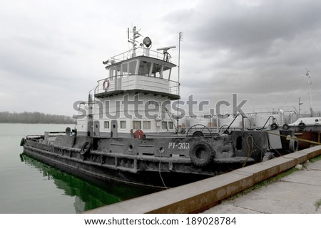 ODESSA, UKRAINE - April 15: Old river trading port Ust -Danube . Human outdated repair river vessels , barges at the shipyard docks. Ancient Technology , April 15, 2014 Odessa, Ukraine