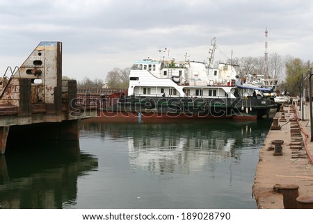 ODESSA, UKRAINE - April 15: Old river trading port Ust -Danube . Human outdated repair river vessels , barges at the shipyard docks. Ancient Technology , April 15, 2014 Odessa, Ukraine