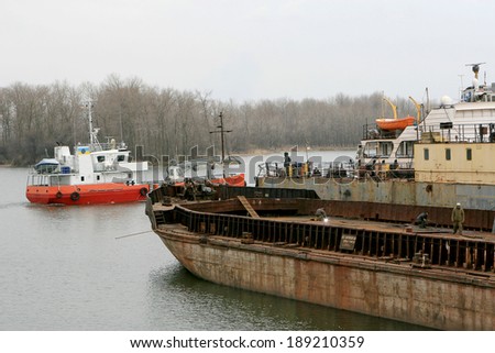 ODESSA - April 15: Old river trading port Ust -Danube . Human outdated repair river vessels , barges at the shipyard docks. Ancient Technology , April 15, 2014 Odessa, Ukraine