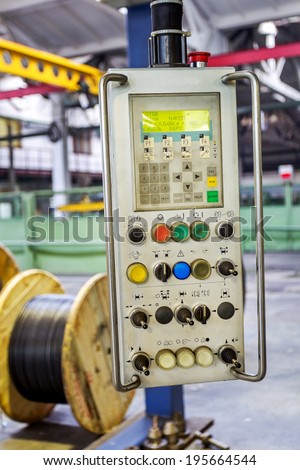 Fragment inside a modern plant producing power electric cables and optical fibers. Interior of modern production line technology obsolescence