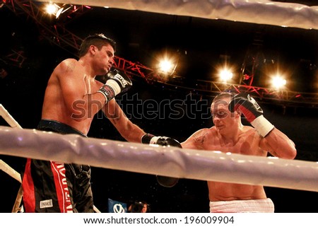 ODESSA, UKRAINE -31 May 2014: World heavyweight boxing champion, Alexander USYK - Ukraine and Cesar David CRENZ  Argentina in the boxing ring. Professional boxing K2, May 31, 2014 in Odessa, Ukraine.