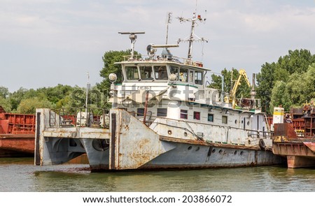Odessa, Ukraine - July 8: river port of Ust-Danube. Older ships and river barges cut into scrap metal, repair docks empty. The results of bad economic policy of Ukraine, July 8, 2014, Odessa, Ukraine